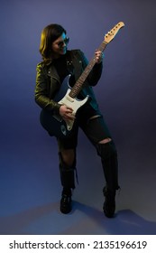 Talented Female Guitarist Playing Her Solo Performance During A Rock And Roll Song In The Concert