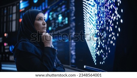 Talented Muslim Software Programmer Working in Technological Innovative Agency Startup. Young Female Manager Dealing with Cloud Based Neural Network Research and Development