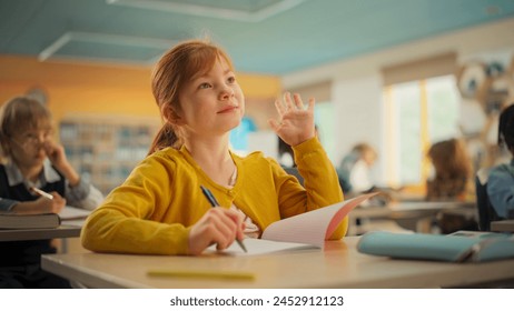 Talented Small Girl Asking Teacher a Question in Class. Portrait of a Happy Elementary School Student Studying Hard, Learning New Things, Getting Modern Education Together with Other Diverse Kids - Powered by Shutterstock