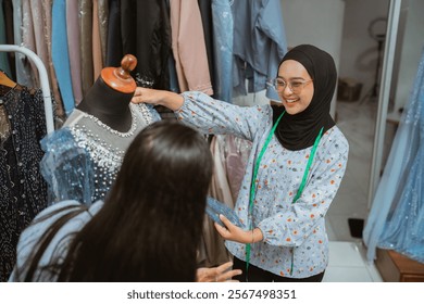 Talented women collaborate on unique fashion designs in a vibrant boutique, showcasing creativity - Powered by Shutterstock