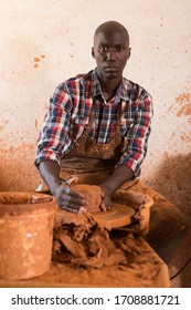 Talented Young African Potter At His Own Pottery Studio Working On New Unique Items 