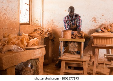 Talented Young African Potter At His Own Pottery Studio Working On New Unique Items