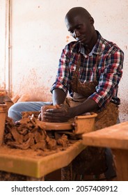 Talented Young African Potter At His Own Pottery Studio Working On New Unique Items