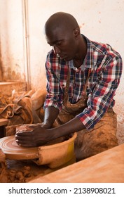 Talented Young African Potter At His Own Pottery Studio Working On New Unique Items