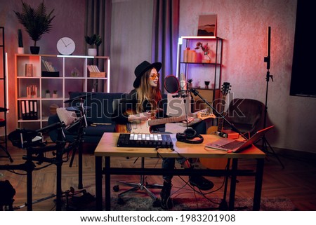 Image, Stock Photo Young woman recording with smartphone stabilizer outdoors