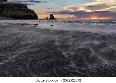 Talisker bay isle of sky at sunset with patterns in sand