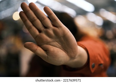 Talk to the hand. Camera shy subject blocking view of face. Shallow depth of field with bokeh background. - Powered by Shutterstock