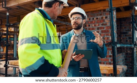 Talk, manager and architect with tablet for construction planning, building update and teamwork. Blueprint, architecture and men with tech outdoor for site regulations, code compliance and discussion