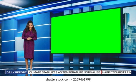 Talk Show TV Program: Beautiful Black Female Presenter Standing In Newsroom Studio, Uses Big Green Chroma Key Screen. News Achor, Host Talks About News, Weather. Mock-up Cable Channel