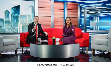 Talk Show TV Program And News Discussion: Two Charismatic Presenters Talk, Have Fun. Cable Channel Hosts Have Friendly Conversation. Morning, Breakfast Television Entertainment In Studio Concept