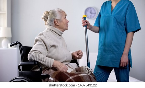 Talkative Old Lady In Wheelchair Gossiping With Hospital Janitor, Loneliness