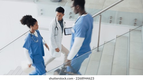 Talking, busy and doctors walking in hospital or stairs for clinic services, results or healthcare planning of documents. Research, report and nurse or professional medical people advice or strategy - Powered by Shutterstock