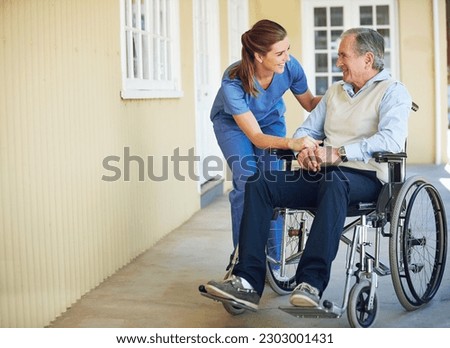 Talking, happy caregiver or old man in wheelchair in hospital helping an elderly patient for support in clinic. Medical nurse or healthcare social worker speaking to a senior person with disability