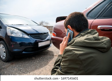 Talking Man With Car Accident In Street Background
