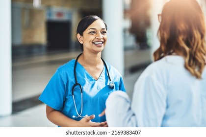Talking to the right people for the best advice. Cropped shot of two medical practitioners having a discussion in a hospital. - Shutterstock ID 2169383407