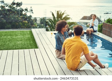 Talking, swimming pool and friends by poolside in outdoor for party, summer vacation or sunshine. Blue sky. diversity and group of people on floor for holiday, relax or weekend trip in Mallorca - Powered by Shutterstock