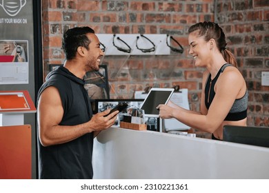 Talking, tablet fitness and an Asian man with a woman for a gym membership and health app. Happy, showing and an exercise club employee with technology for an athlete for training and sports - Powered by Shutterstock