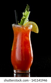 tall bloody mary isolated on a black background