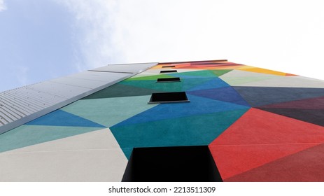 Tall Building With Windows Seen From Below With Different Colors