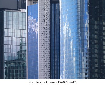 Tall City Skycrapers Buildings With Shinny Glass And Blue Sky Relfections