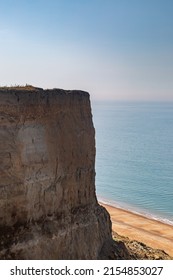 Tall cliffs at Whale Chine on the Isle of Wight, with the sandy beach below
