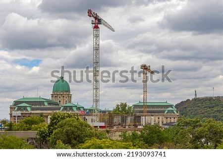 Tall Cranes at Buda Castle Palace Construction Site Cloudy Weather
