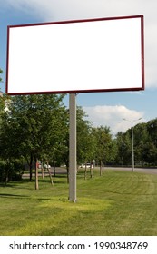 Tall Empty Billboard On A Mowed Lawn On A Bright Summer Day. Mock Up.