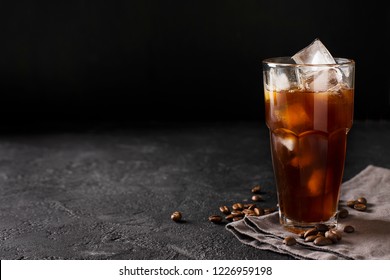 Tall Glass Cold Brew Coffee With Ice  On Black Or Dark Background