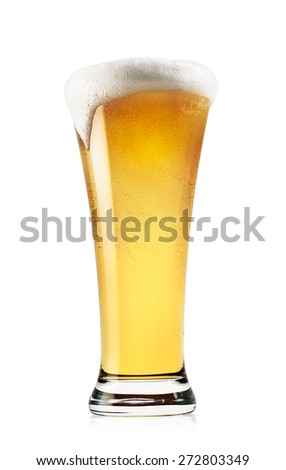 Tall glass of light beer with foam isolated on a white background