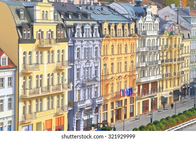 Tall hotels and traditional buildings on sunny street in Karlovy Vary, Czech Republic