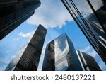 Tall office skyscrapers with sky reflection in windows, business concept banking background