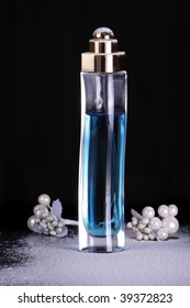 perfume in tall blue bottle