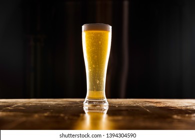 Tall Pilsner Glass Full Of Golden Beer