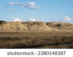 Tall Plateaus with Talis to The Grassland Valley with Railroad Tracks in the Forground in Point of Rocks, Sweetwater County, Wyoming
