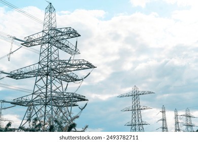 Tall Power Transmission Towers Against Cloudy Sky - Powered by Shutterstock