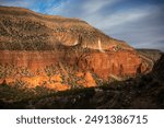 Tall red mesa near the Jemez Pueblo in New Mexico during golden hour.