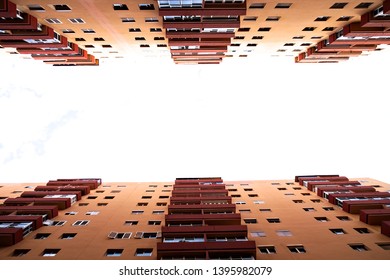 Tall riser multi storey apartment buildings in the city, looking up towards the sky, visual representation of city canyon, two buildings one each side of the frame.