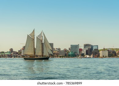 Tall ship in the harbour with Halifax downtown skyline on a sunny day (During the Nova Scotia Tall Ship Festival 2017)