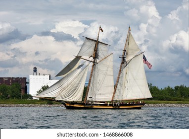 A Tall Ship Sails Past A Portion Of The Buffalo, NY Waterfront.