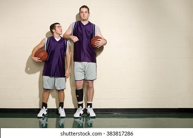 Tall and short basketball players - Shutterstock ID 383817286