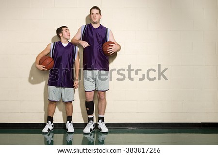 Tall and short basketball players