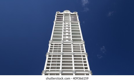 Tall skyscraper under deep blue sky