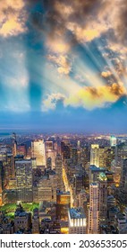 Tall Skyscrapers Of Midtown Manhattan, Night Aerial View.