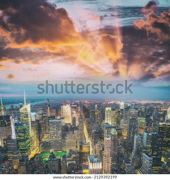 Tall\
skyscrapers of Midtown Manhattan, night aerial\
view.