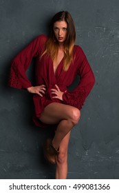 Tall Slim Brunette Dressed In A Red Wrap Dress