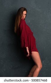 Tall Slim Brunette Dressed In A Red Wrap Dress