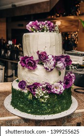 Tall, Tiered Cake For A Wedding With Decoration On It