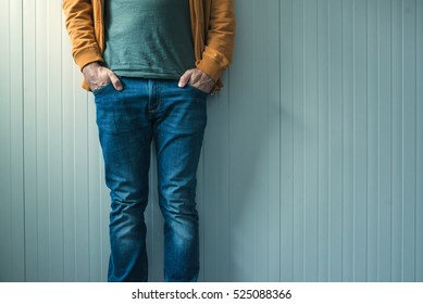 Tall Unrecognizable Casual Man In Jeans Posing, Wall As Copy Space.