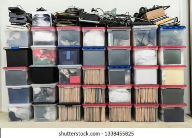 Tall Wall Of Plastic File Storage Boxes With Folders, Binders And Miscellaneous Business Office Supplies.  