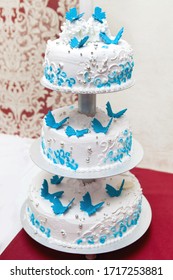 Tall Wedding Cake With Blue Butterflies